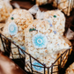 Custom branded favor stickers on popcorn bags for a business event