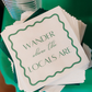 Custom printed cocktail napkins displayed at a branded business event